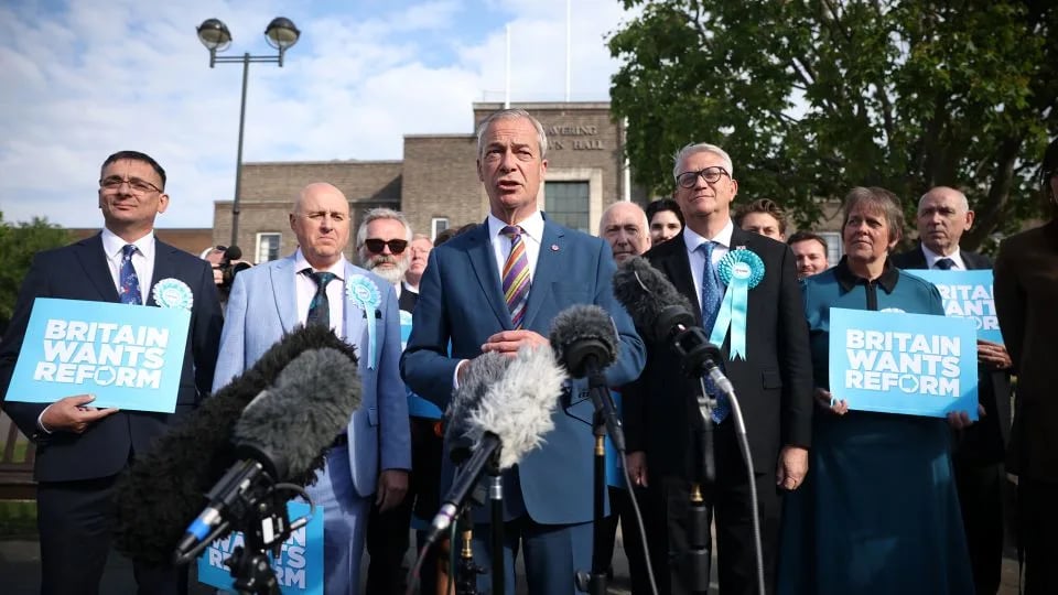 Nigel Farage reacts after Reform UK gains seats in local elections