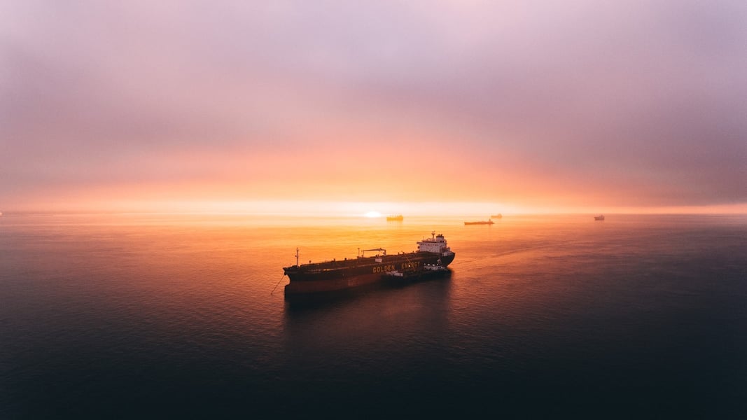 Oil tanker sailing through open sea as Brent crude prices fall on US-Iran deal progress