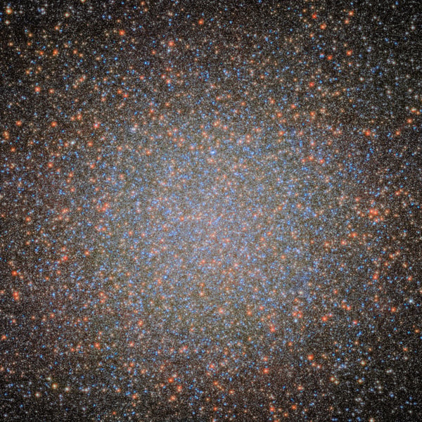 NASA ESA Hubble Space Telescope image of Omega Centauri the largest globular cluster in the Milky Way where stars cluster densely around an intermediate-mass black hole candidate