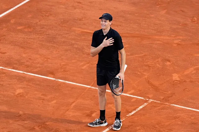Sinner dominant serve Roland Garros 2026 Jannik Sinner serving during Roland Garros 2026 match on clay court