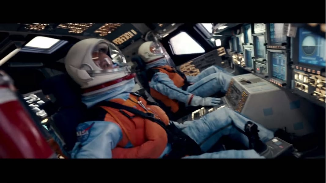 SpaceCamp 1986 film cast including Lea Thompson Tate Donovan Kelly Preston and Joaquin Phoenix credited as Leaf Phoenix inside the space shuttle set