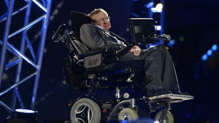 Stephen Hawking in his wheelchair using his trademark speech synthesizer at the University of Cambridge