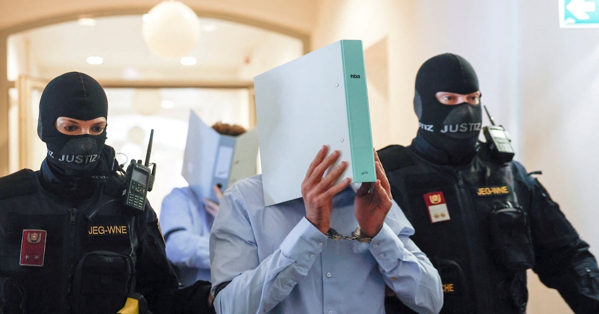 Beran A. covers his face as he enters the Wiener Neustadt court before being sentenced to 15 years over the Taylor Swift Vienna terror plot