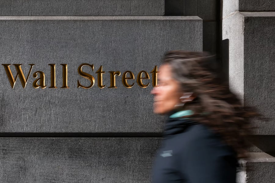 Donald Trump displayed on Wall Street trading screens amid stock trade controversy