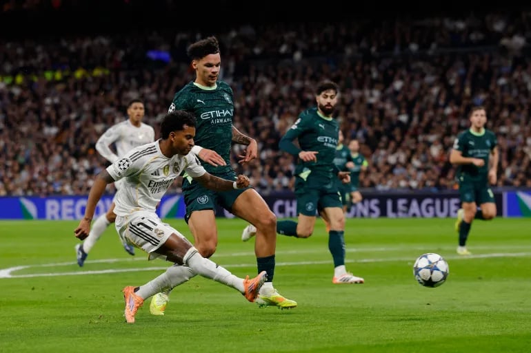 UEFA Champions League semifinal stadium packed crowd under floodlights during intense match action