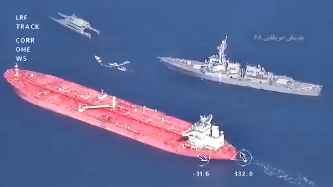 US Navy warships near Iranian oil tankers during the 2026 Strait of Hormuz crisis