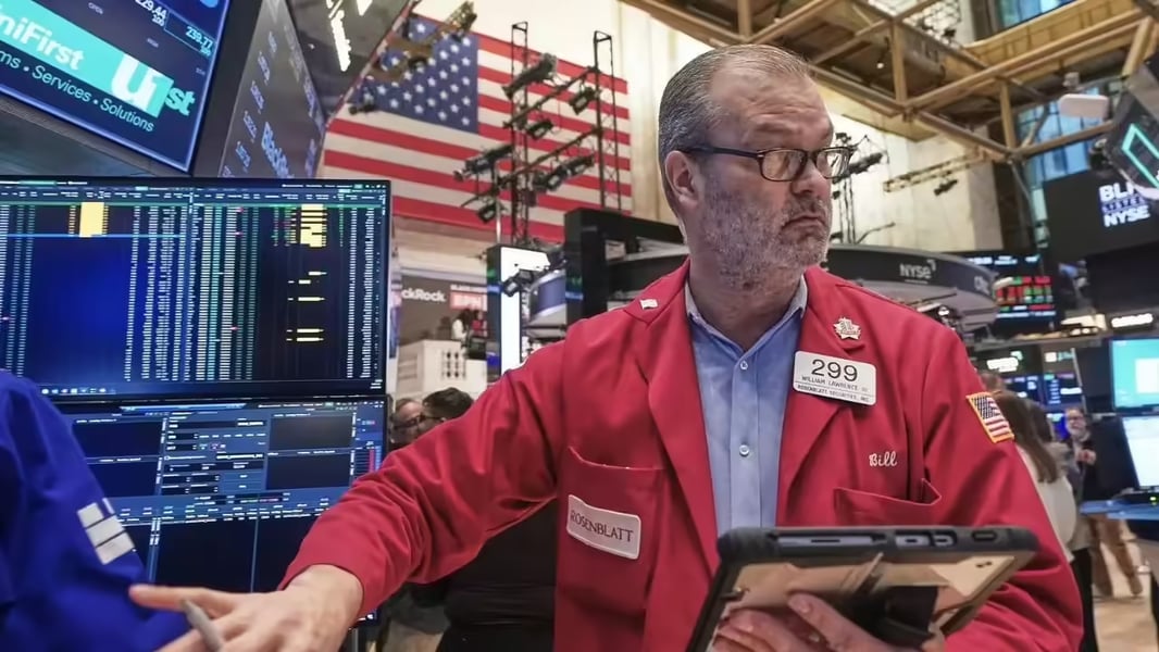 Wall Street traders react as Nasdaq and S&P 500 hit record highs amid AI stock rally