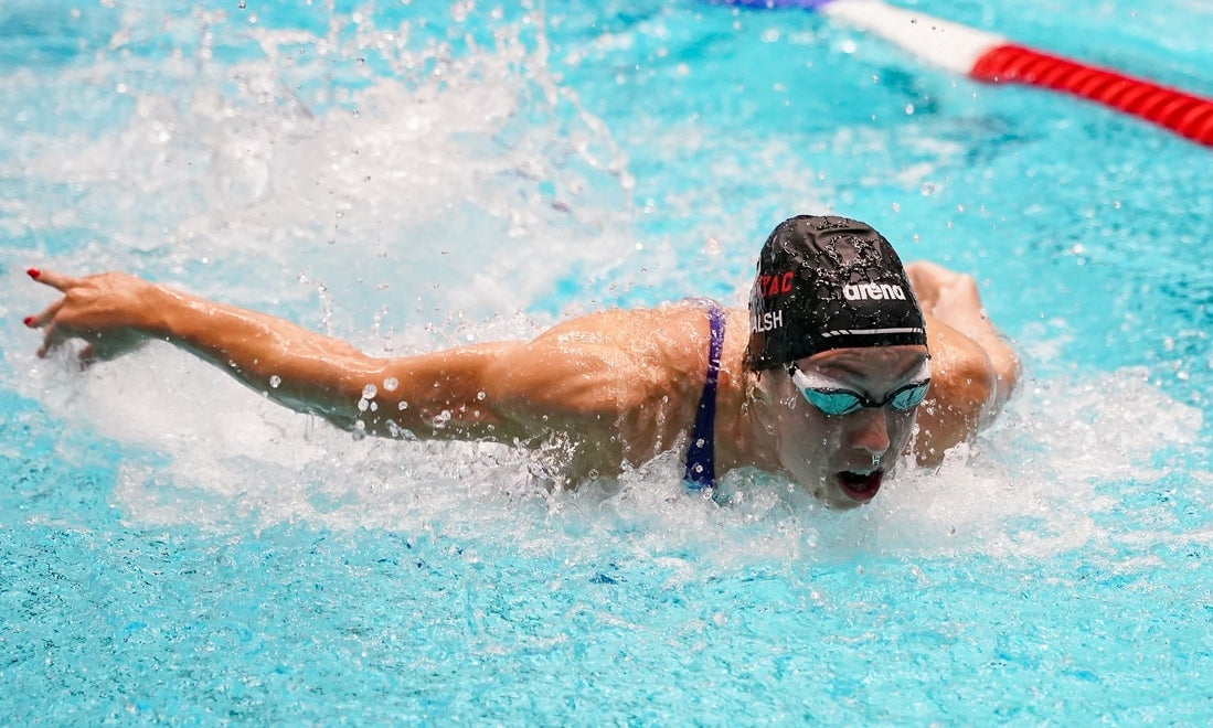 Gretchen Walsh competing in the women's 50-meter butterfly at an international swimming meet