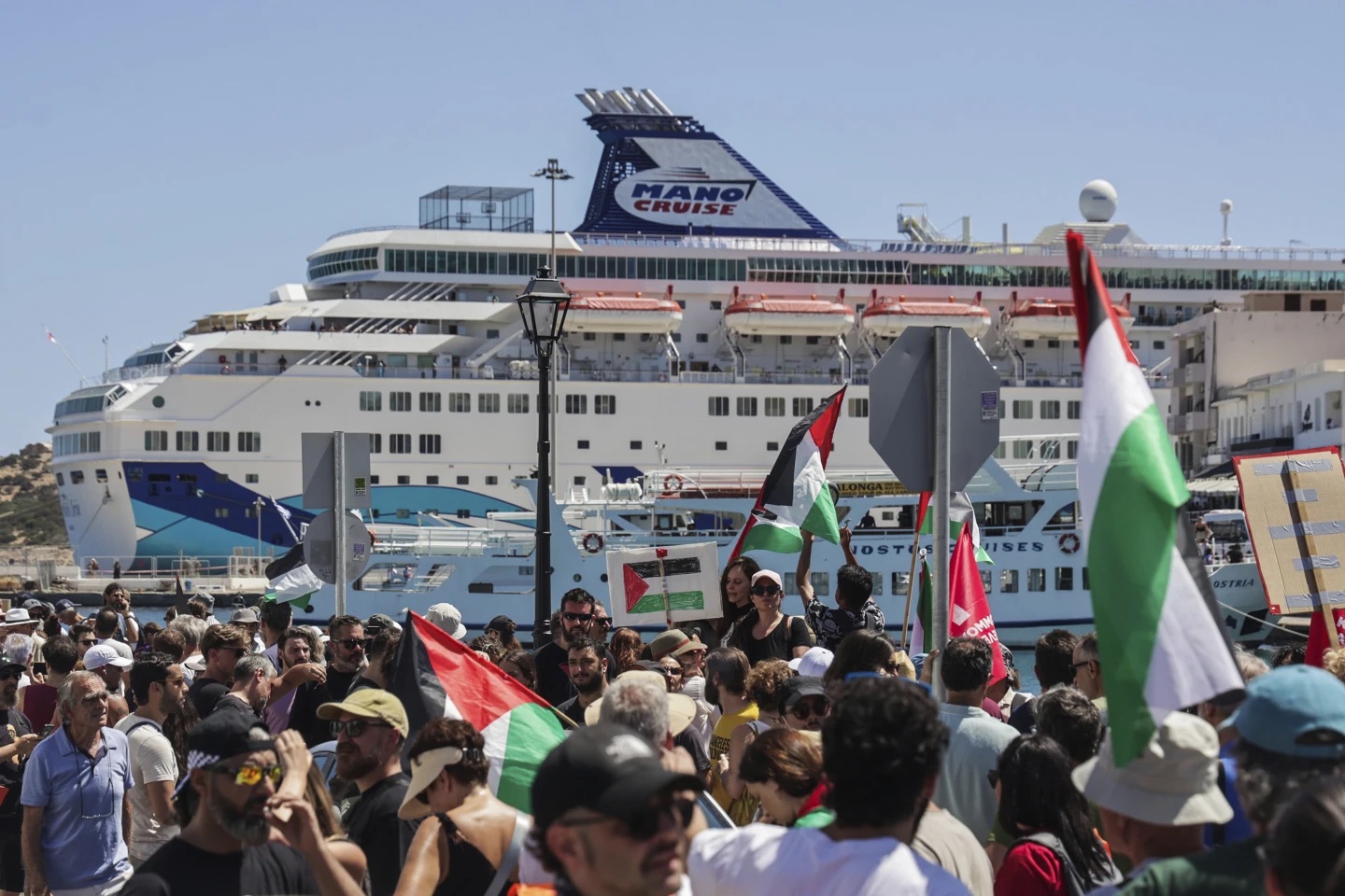 Greek riot police stand guard at the port of Agios Nikolaos Crete during arrival of Israeli cruise ship Crown Iris July 2025