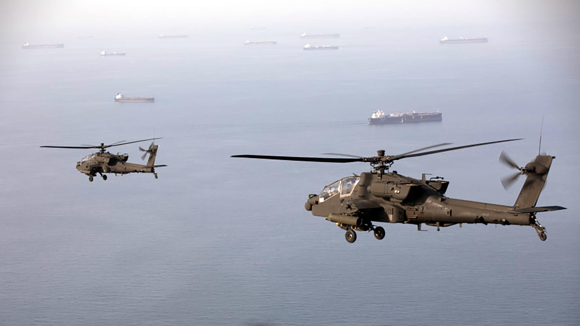 US Army AH-64 Apache attack helicopters patrolling Strait of Hormuz during Operation Epic Fury