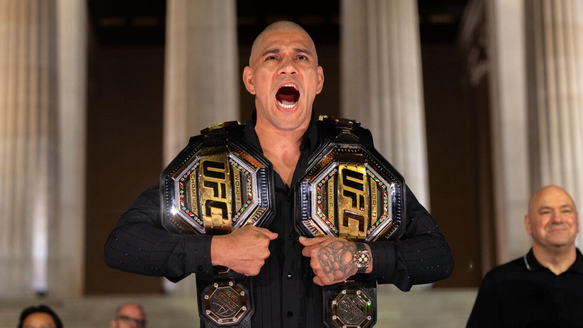 Alex Pereira poses with UFC championship belts ahead of his heavyweight debut at UFC Freedom 250 at the White House