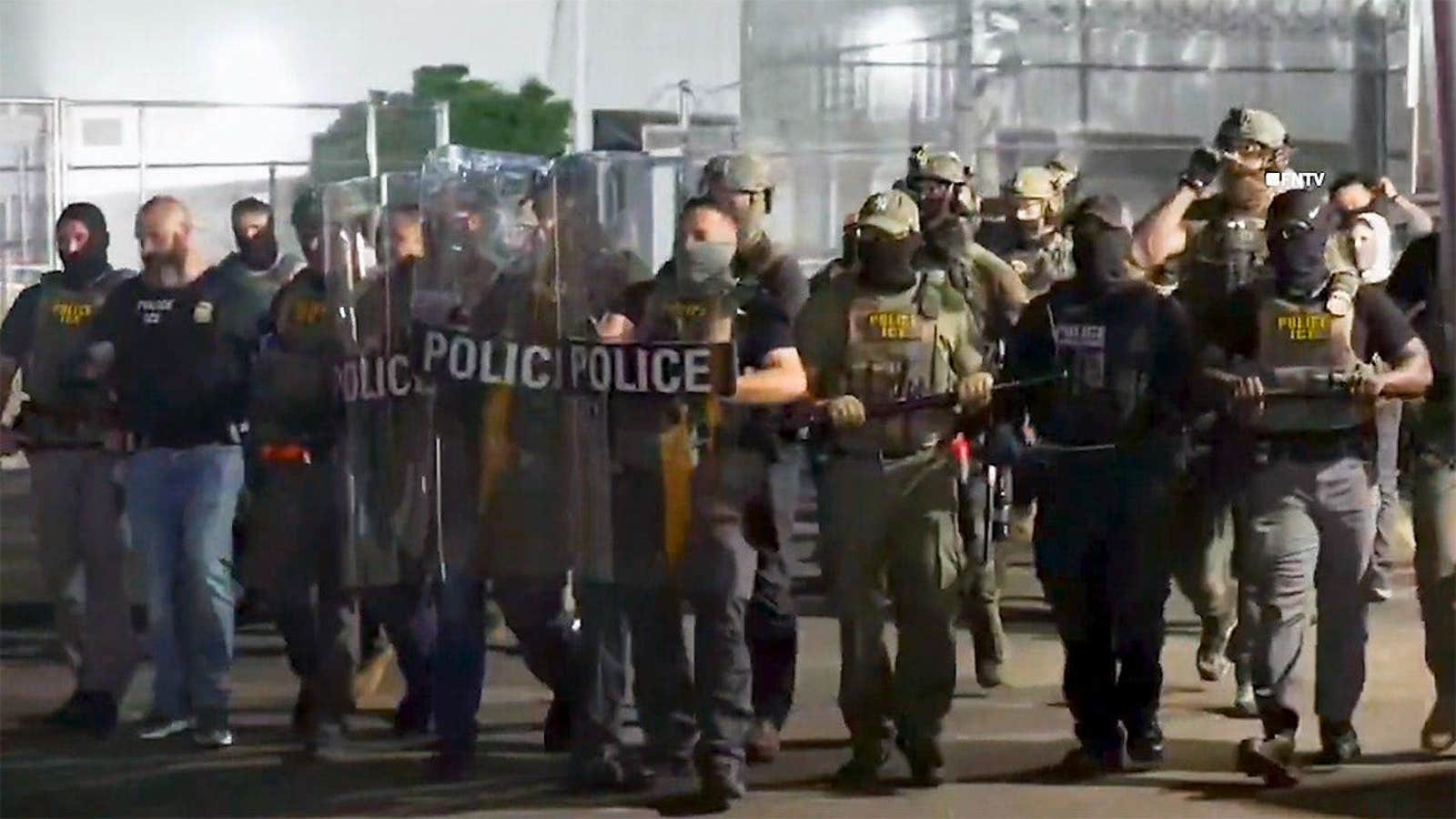 Demonstrators protest against ICE immigration enforcement outside a detention facility