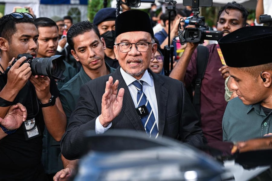 Anwar Ibrahim greets supporters after becoming Malaysia's prime minister in 2022