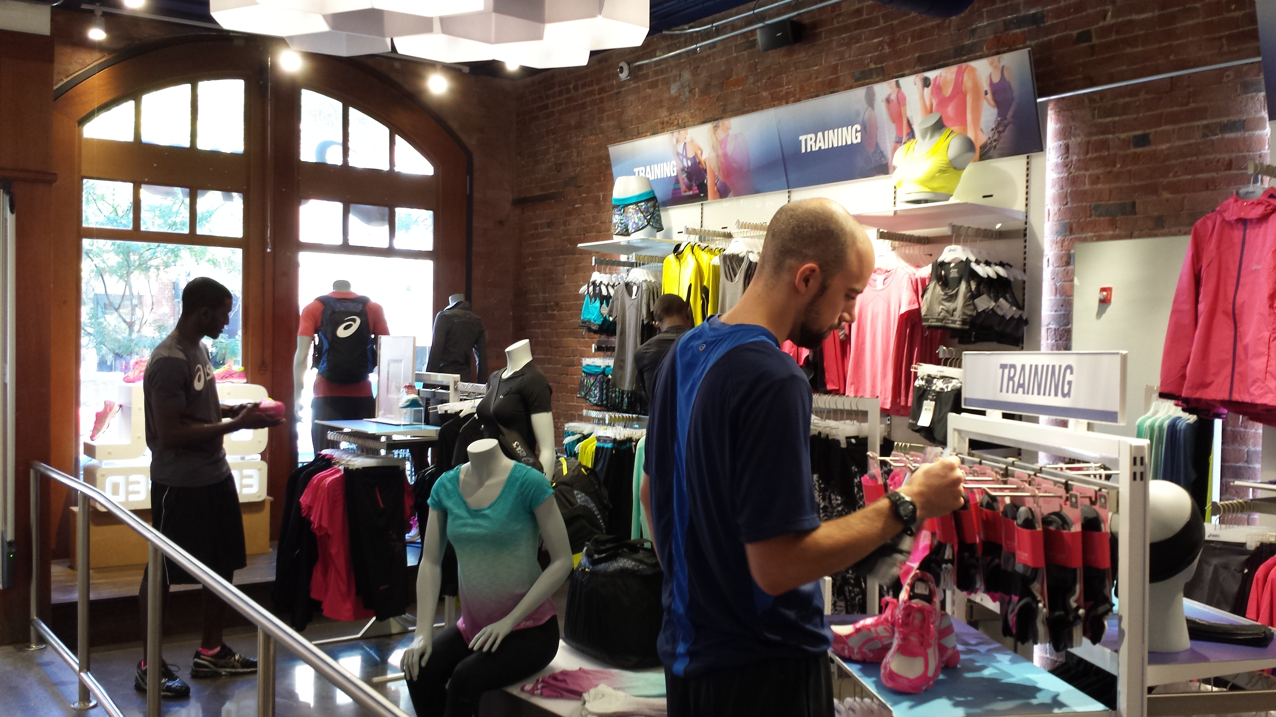 Running shoes displayed inside an Asics retail store in Boston