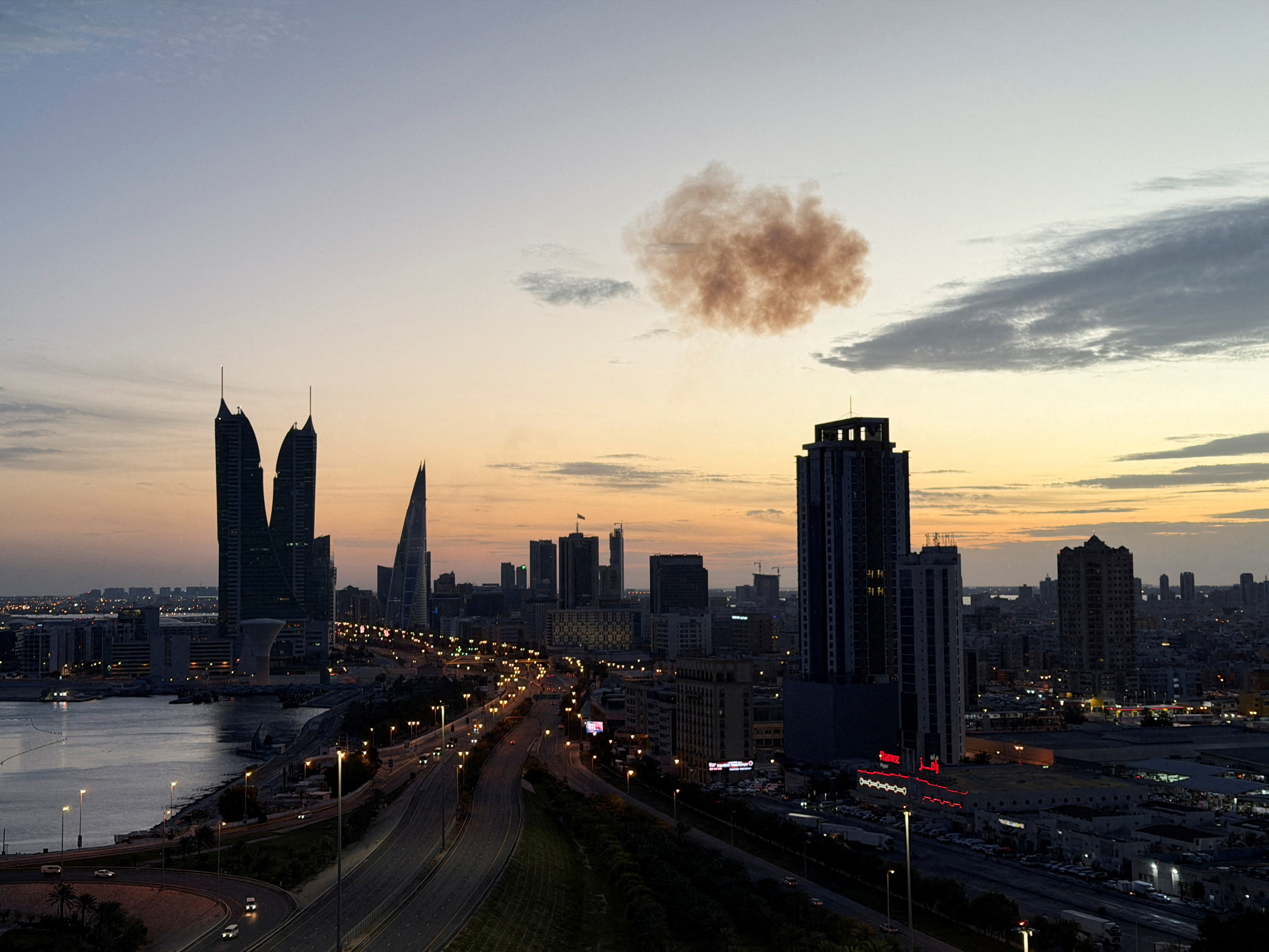 Smoke rises over Bahrain Financial Harbour Towers after Iranian drone interception, Manama, March 2026