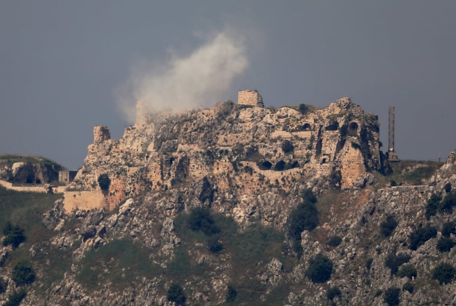 Smoke rises from Beaufort Castle in southern Lebanon as Israeli forces advance and oil prices surge