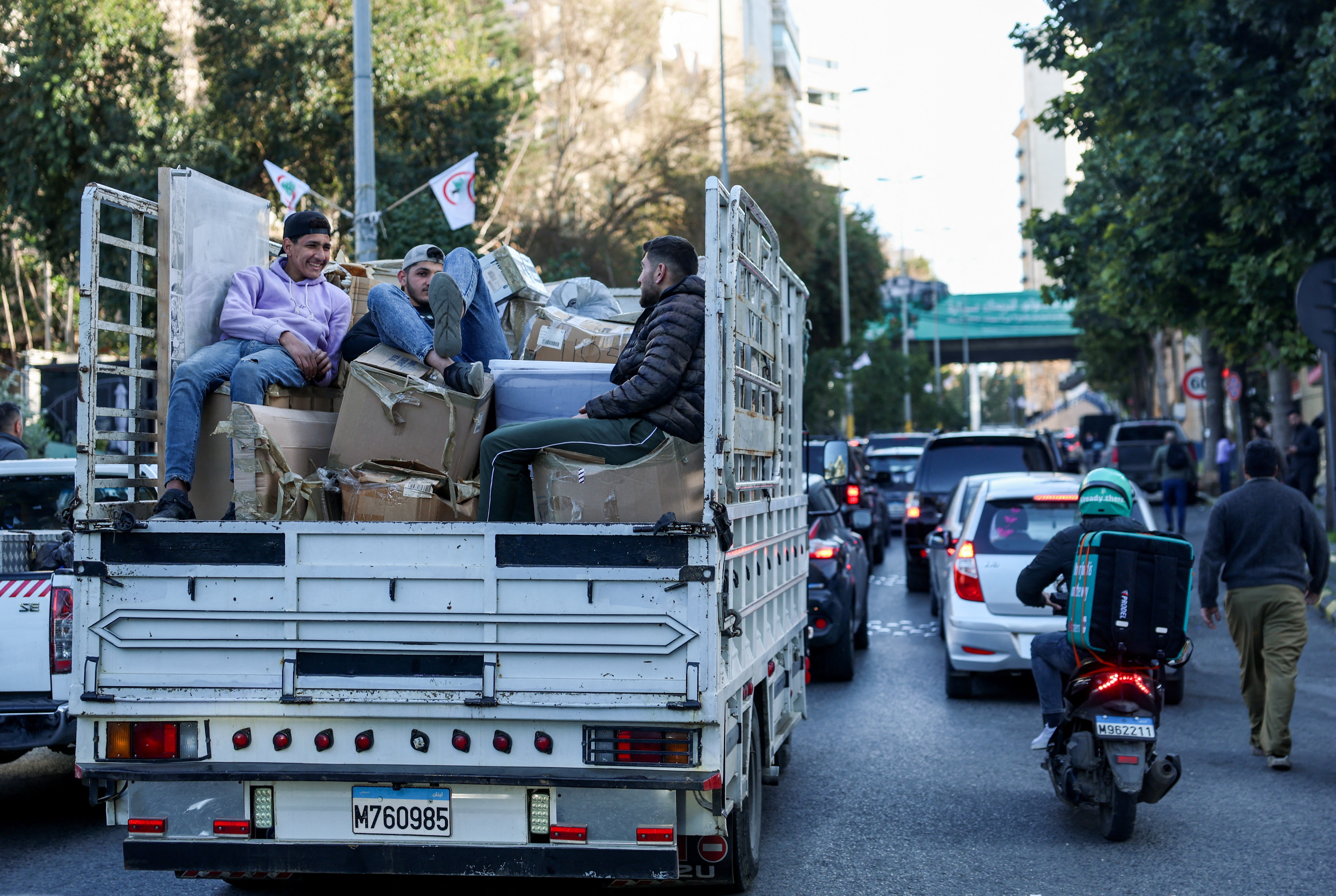 People wait in traffic on a vehicle as residents flee Beirut's Dahiyeh suburb after Israeli evacuation order June 2026