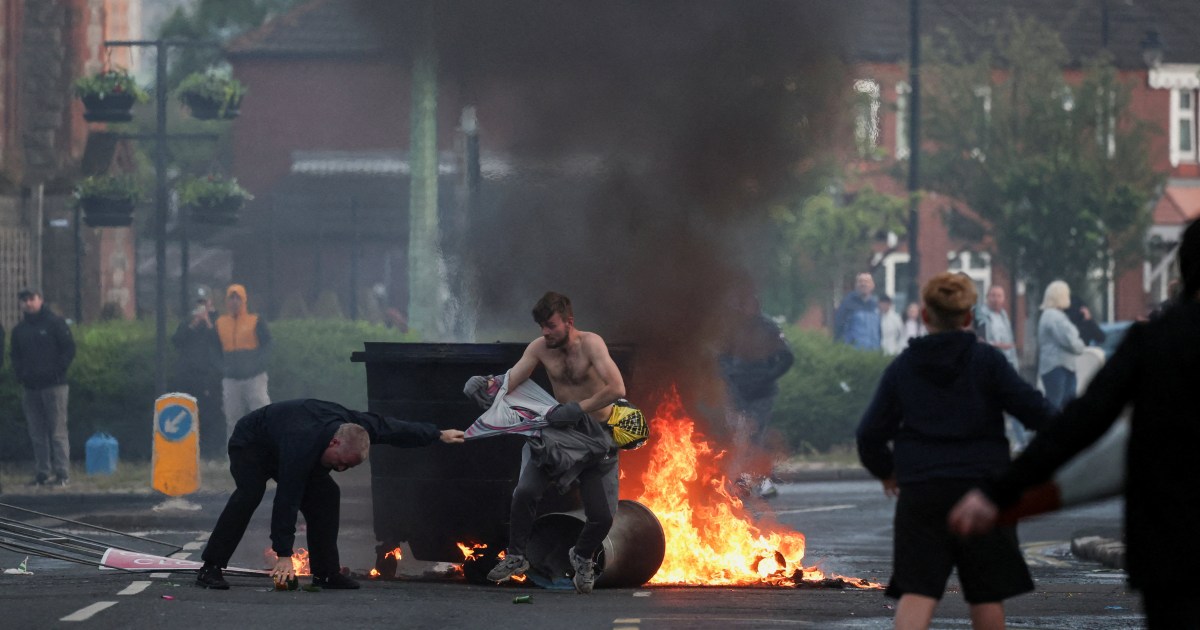 Vehicles set on fire by protesters burning on Newtownards Road east Belfast June 2026