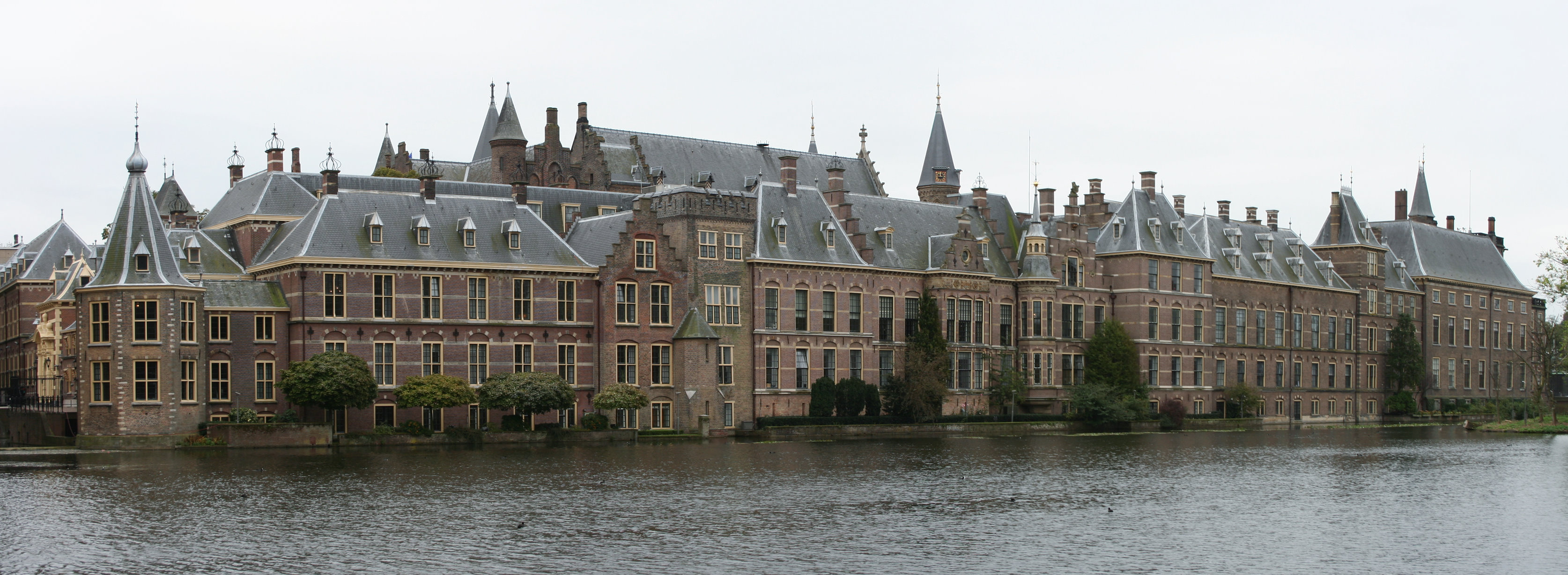 The Binnenhof parliamentary complex seen across the Hofvijver pond in The Hague, Netherlands