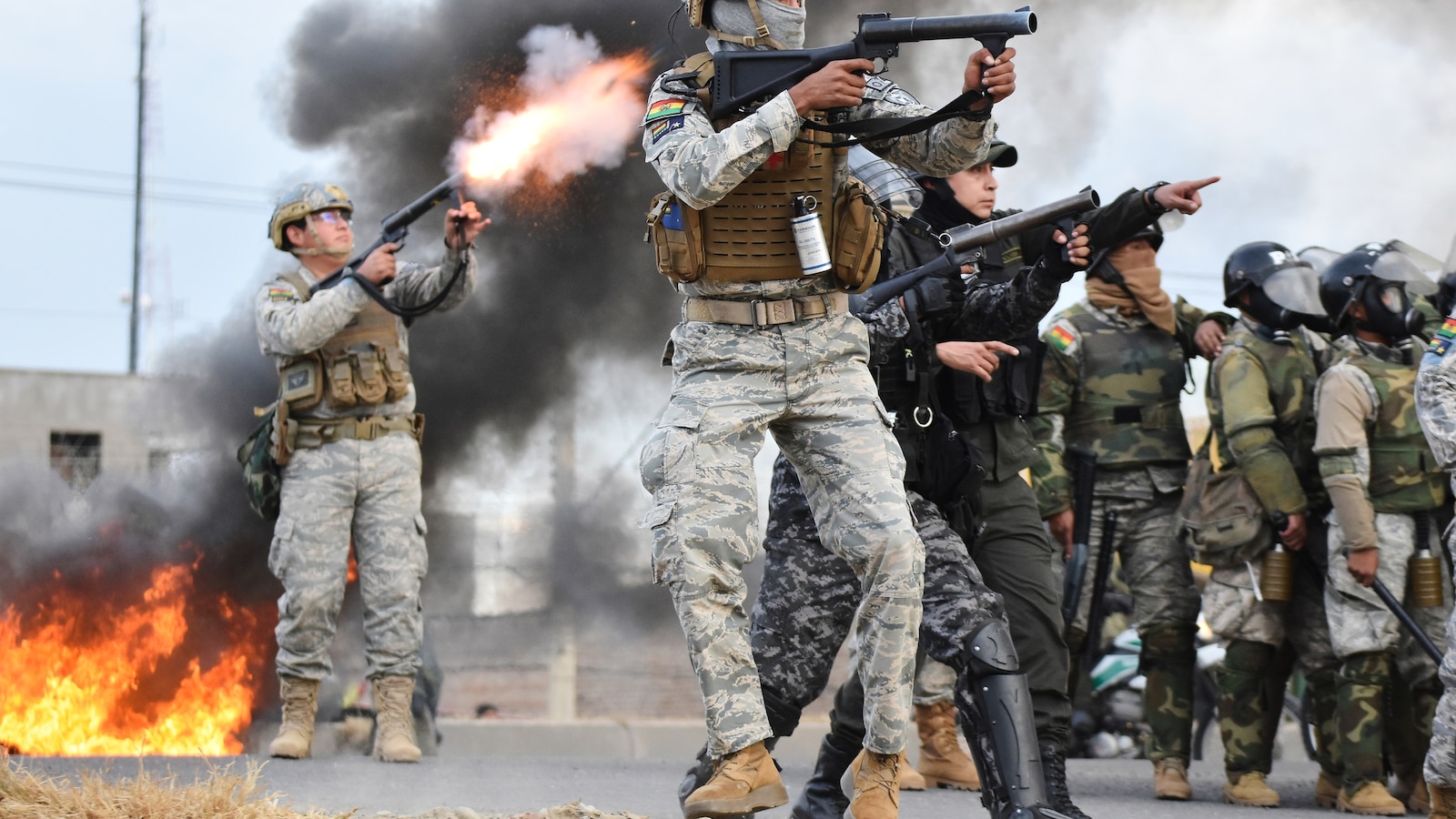 Police fire tear gas at anti-government protesters blocking a highway in Vinto Bolivia June 8 2026