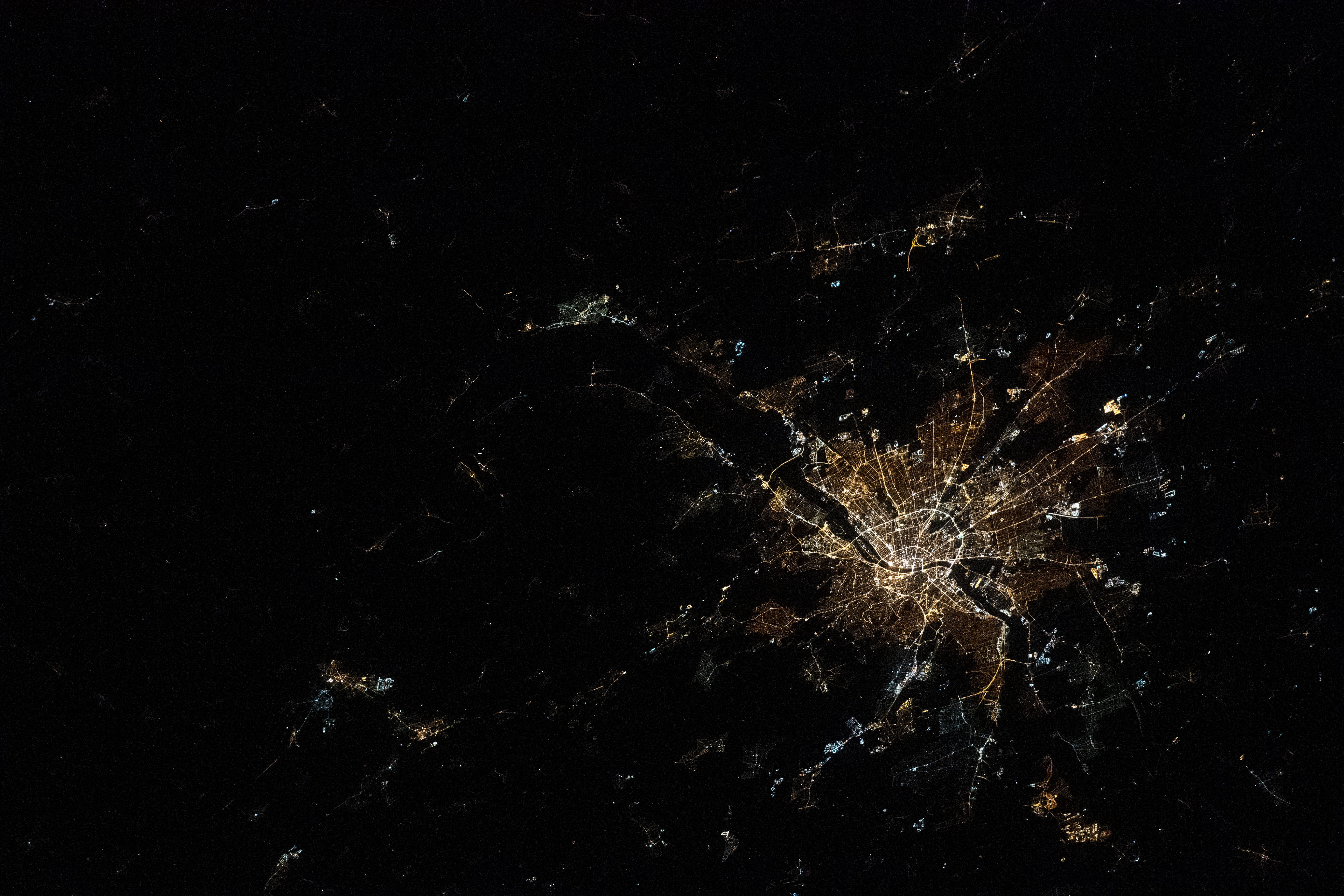 NASA astronaut photograph from ISS of Budapest Hungary at night showing Danube River dividing Buda Pest Obuda