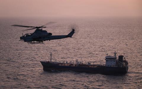 US Marine Corps AH-1Z Viper helicopter conducting maritime operations in the Strait of Hormuz during the Iran naval blockade