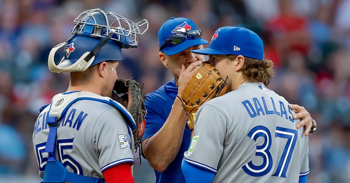 Toronto Blue Jays pitcher Chad Dallas with pitching coach Pete Walker and catcher Tyler Heineman during his MLB debut against the Atlanta Braves, June 4, 2026