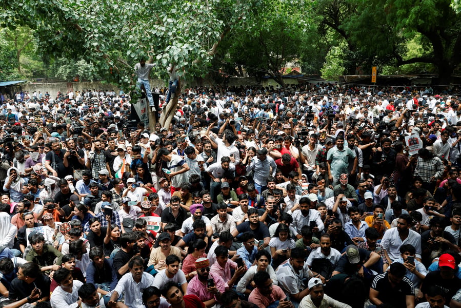 Cockroach Janta Party supporters gather at Jantar Mantar in New Delhi demanding Education Minister Dharmendra Pradhan's resignation over the NEET paper leak
