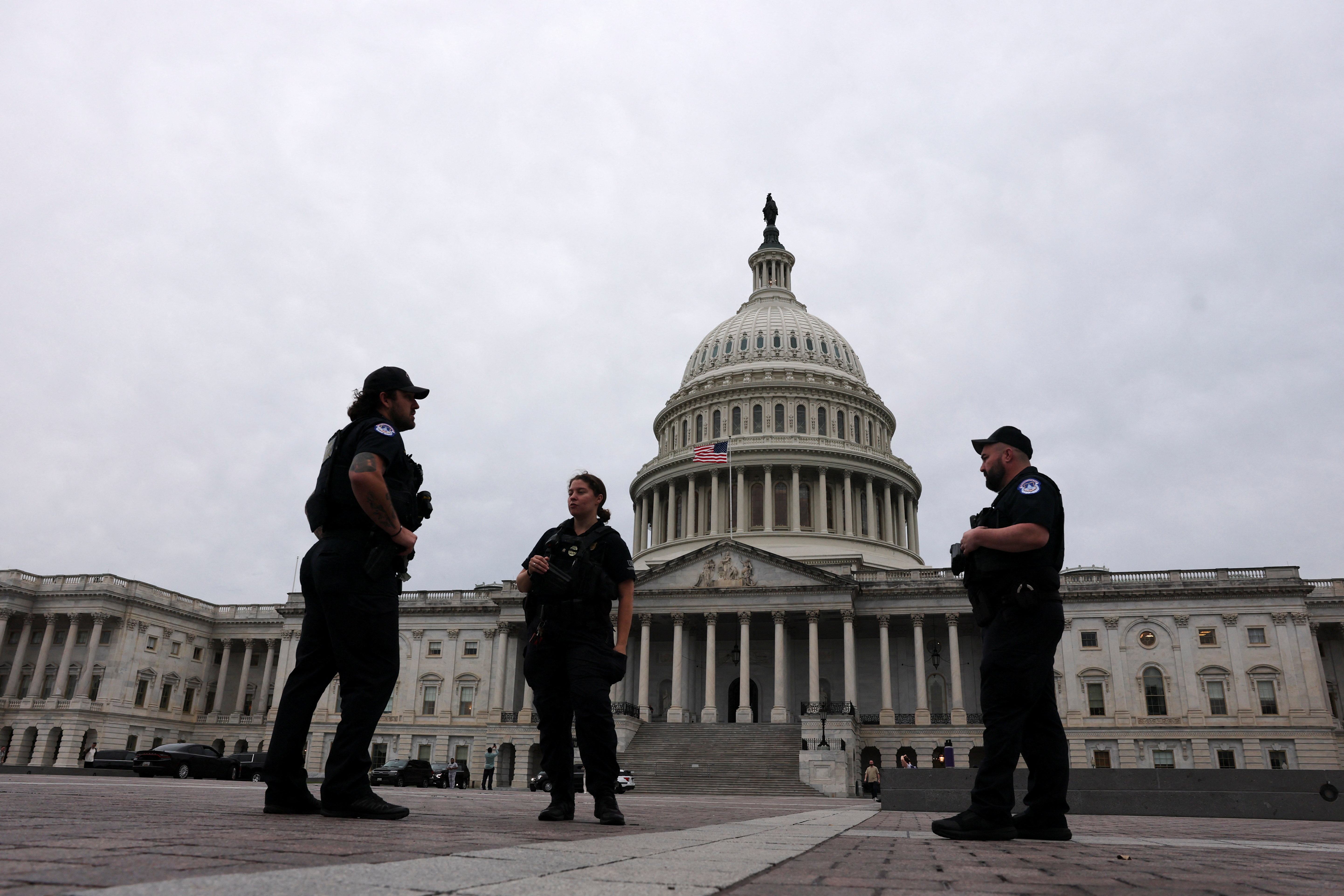 US Capitol Police officers stand outside the Capitol dome as senators vote in Washington DC