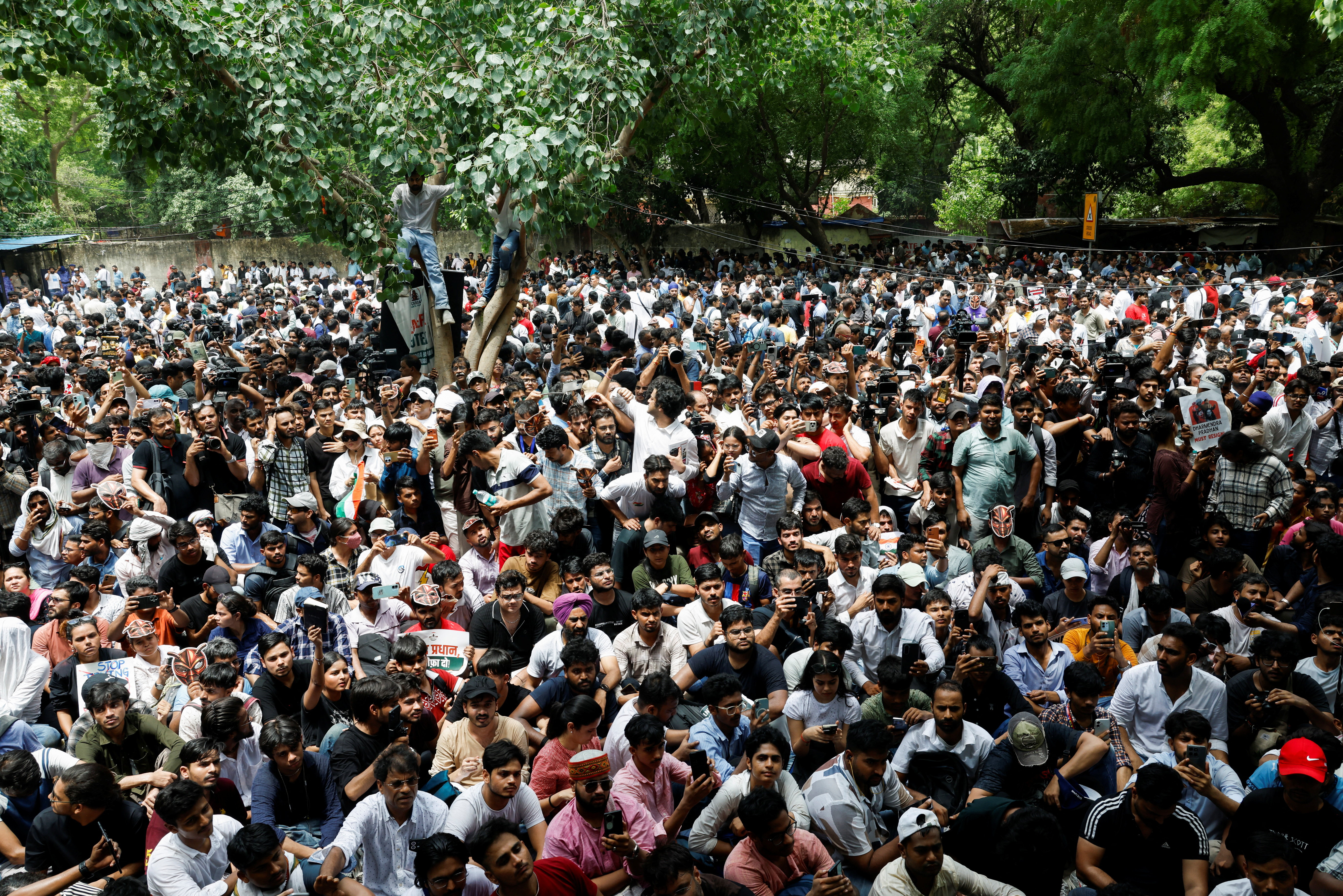 Young protesters wearing cockroach masks at a Cockroach Janta Party rally in New Delhi
