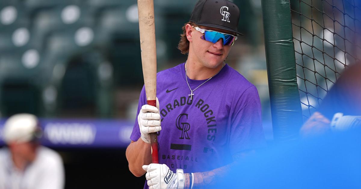 Cole Carrigg celebrates after reaching third base on his debut triple for the Colorado Rockies against the Chicago Cubs at Coors Field on June 9 2026