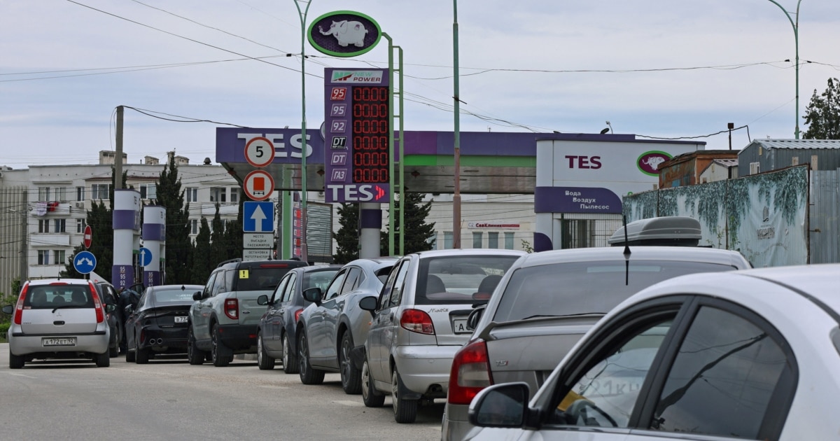Cars queue at a gas station in Sevastopol Crimea during fuel shortage triggered by Ukrainian drone strikes on supply routes June 2026
