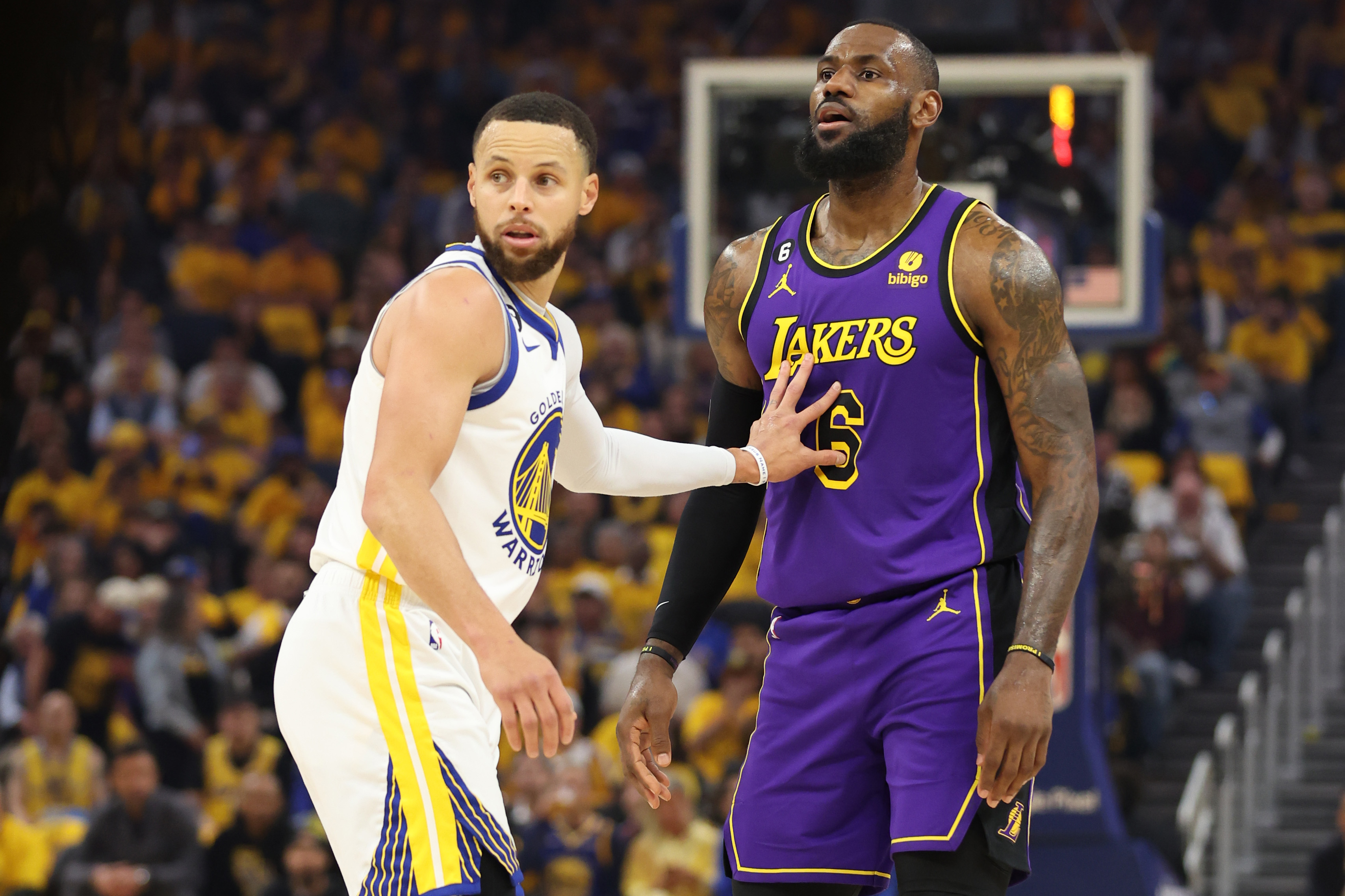 Stephen Curry defends LeBron James during 2023 NBA Playoffs at Chase Center Golden State Warriors