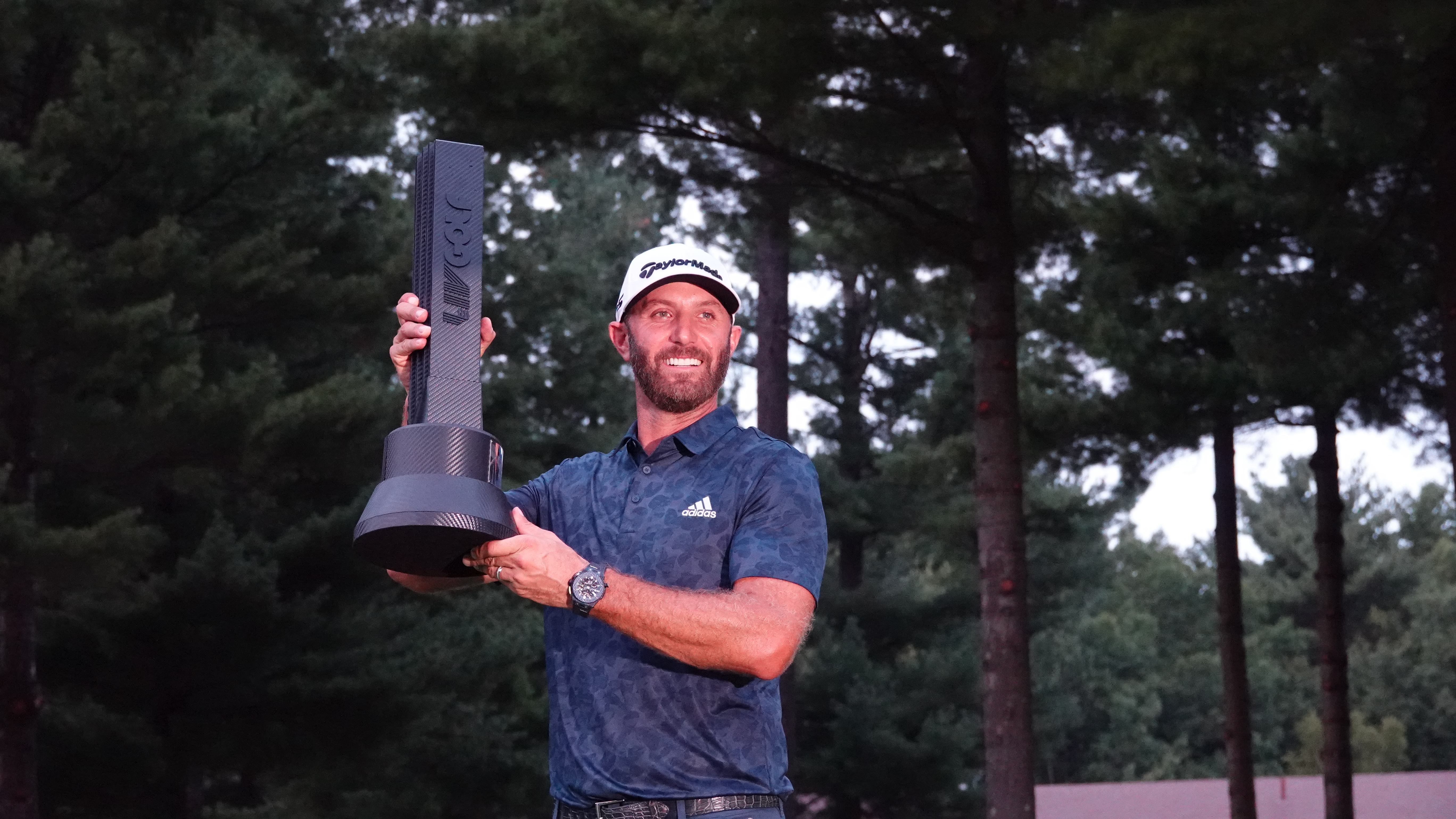 Dustin Johnson celebrating as LIV Golf Boston champion, in the league now facing the end of its Saudi funding