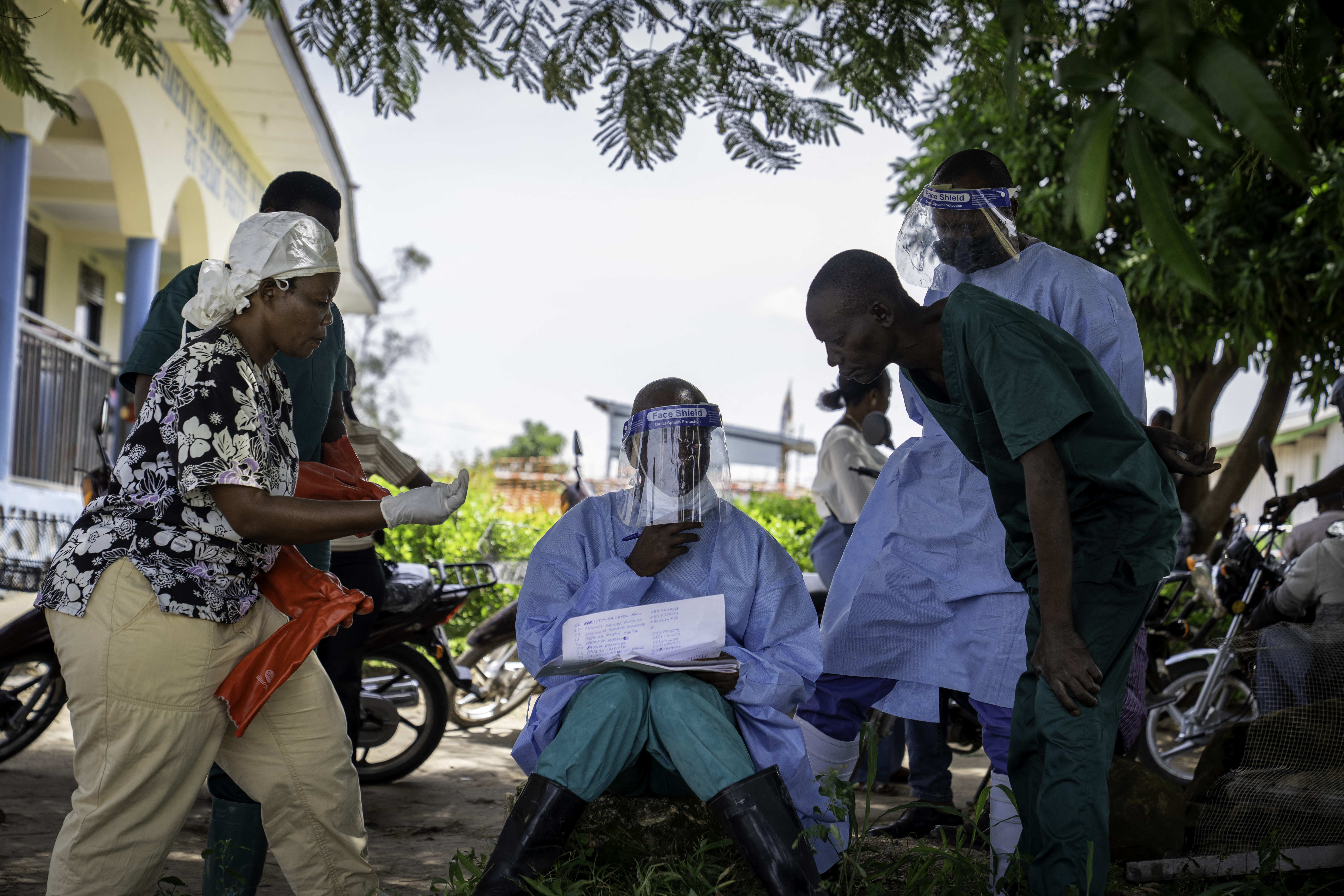 Health worker reviewing patient list at Rwampara Hospital in Ituri province, DRC, during Ebola outbreak