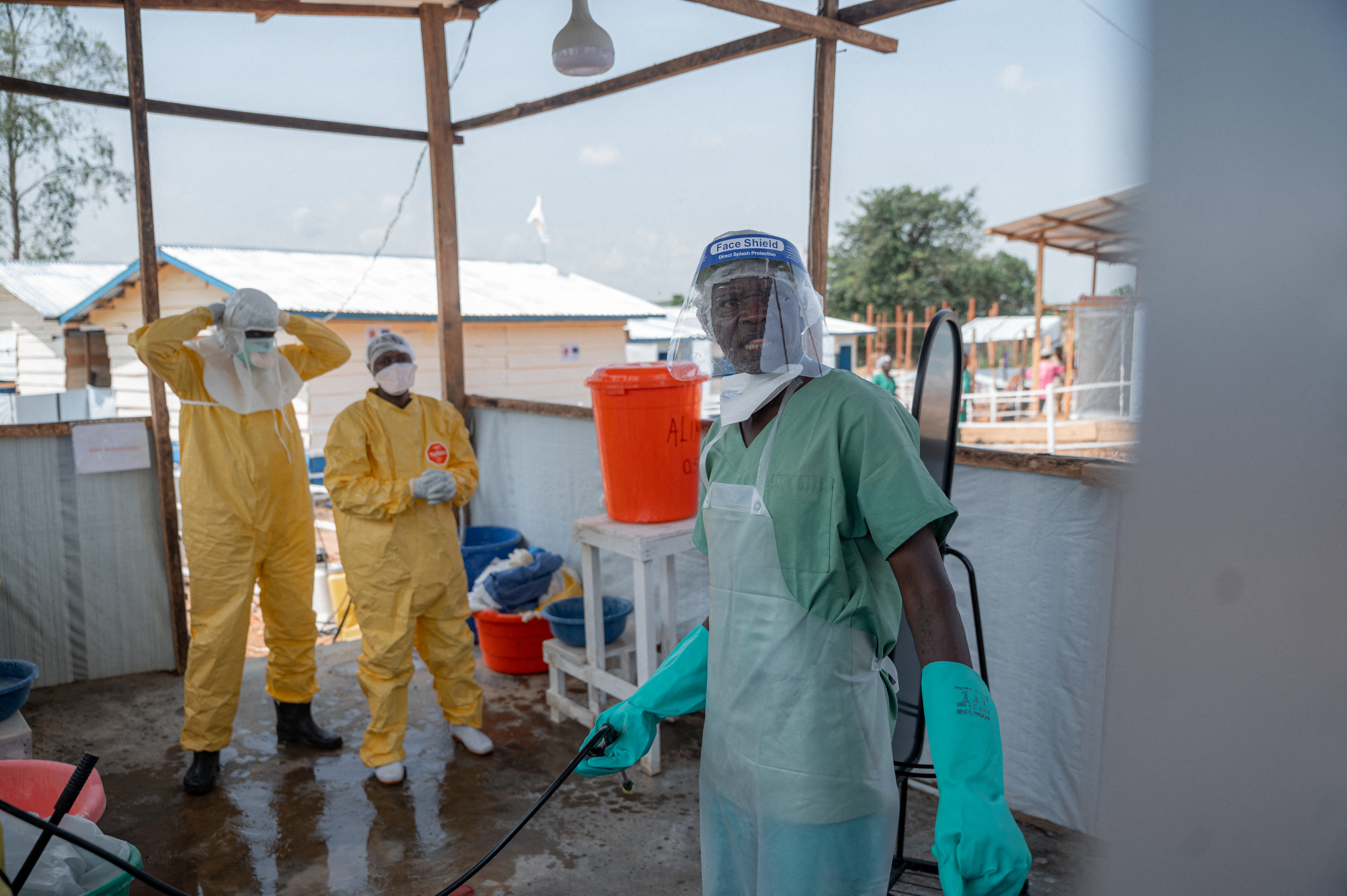 Healthcare workers in protective gear at Ebola treatment centre in Rwampara, Ituri province, DRC