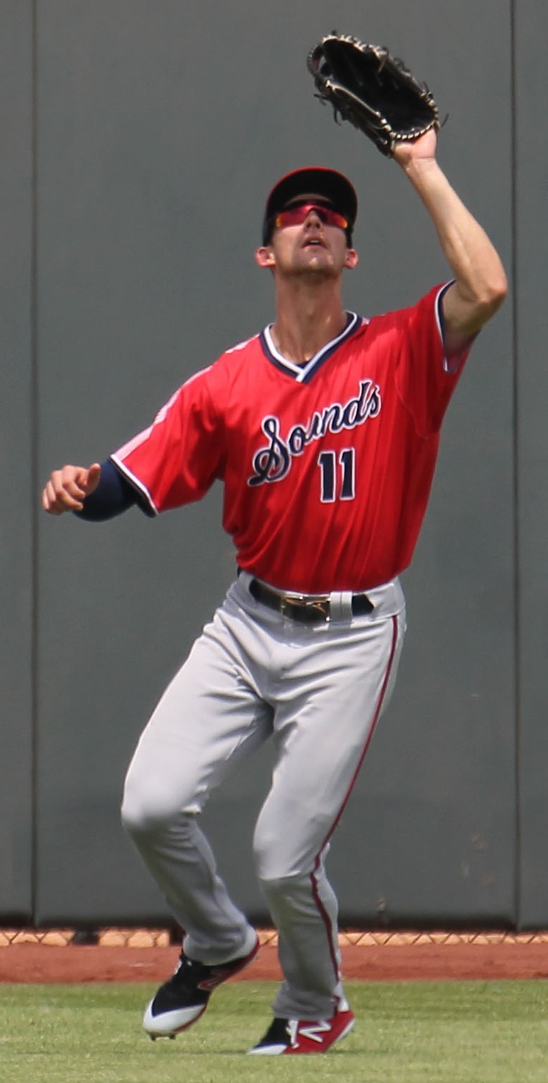 Eli White fielding in the outfield, the Braves hitter who had three hits against the Mets