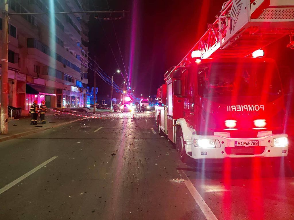 Emergency responders at the site of the Russian drone strike on a residential building in Galati Romania