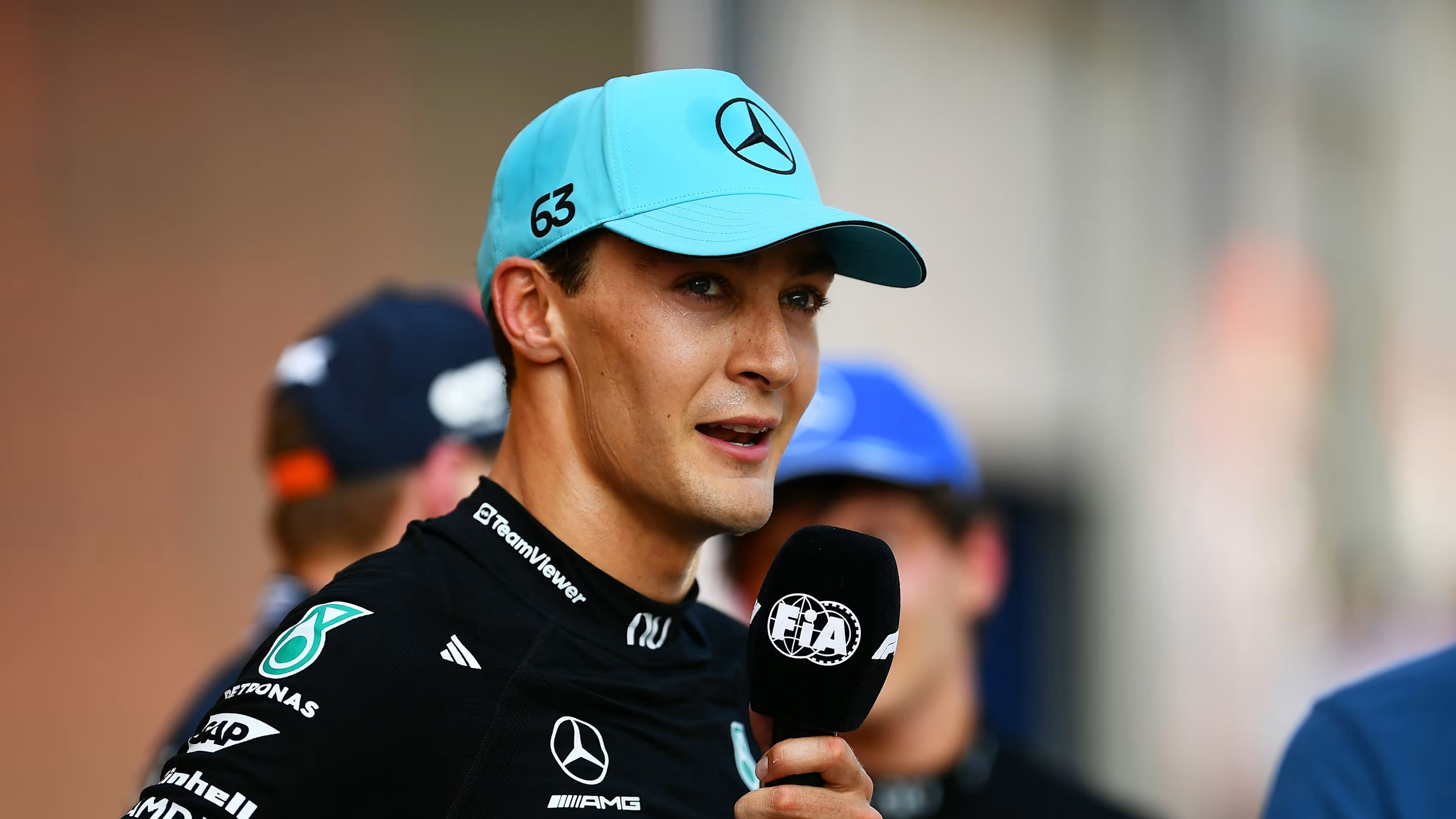 George Russell celebrates on the podium after winning the 2026 Austrian Grand Prix at the Red Bull Ring in Spielberg