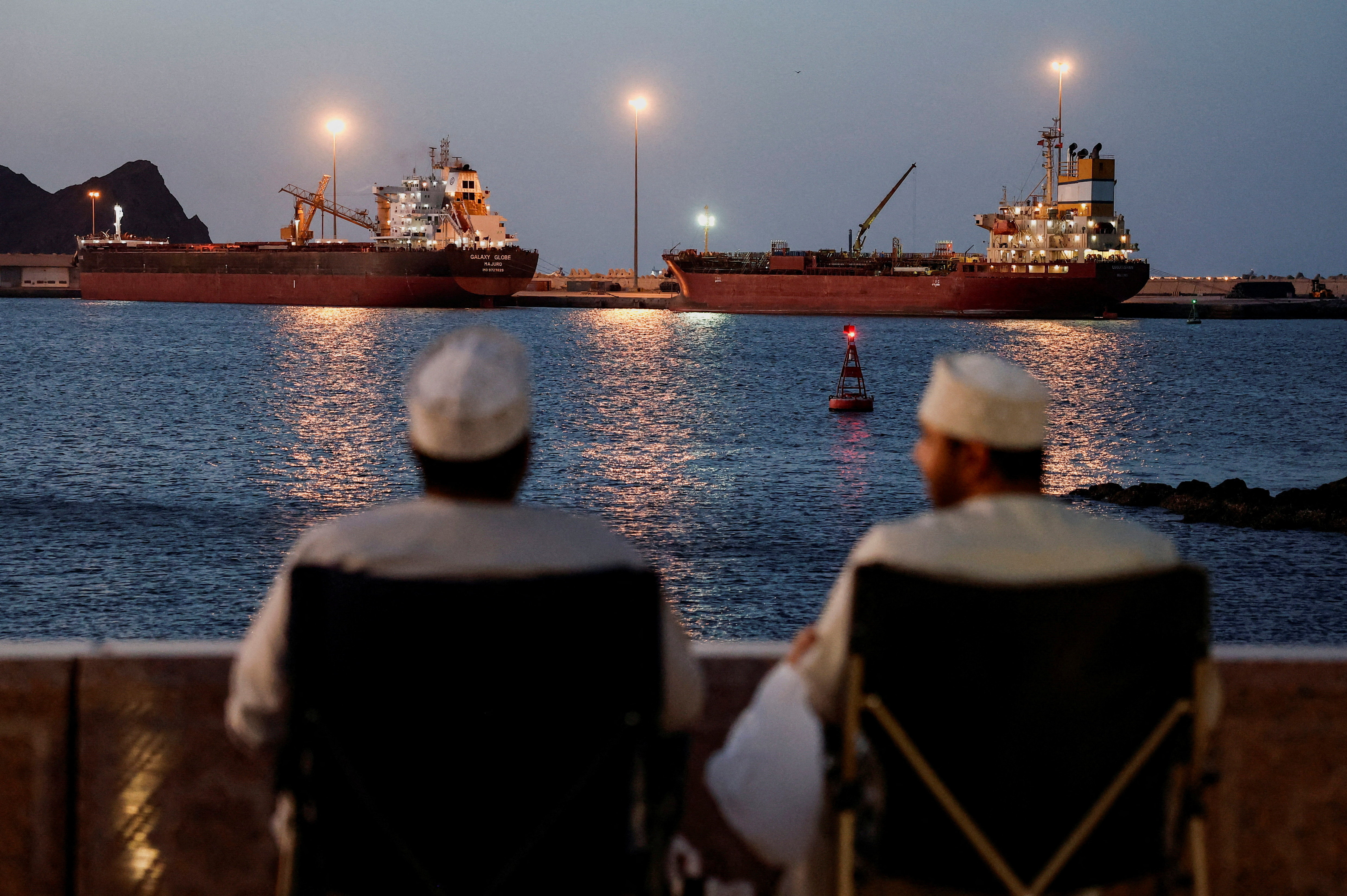 Galaxy Globe bulk carrier and Luojiashan tanker anchored off Muscat, Oman, with Strait of Hormuz closure looming