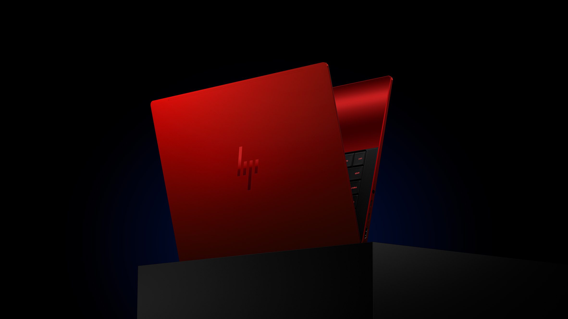 HP Limited Edition Scuderia Ferrari AI PC in Rosso Magma red with transparent engine bay base panel