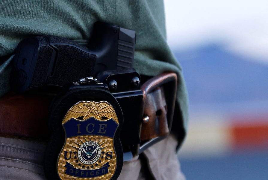US Immigration and Customs Enforcement agents during an enforcement operation