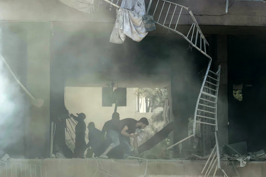 Smoke rises over Dahieh, Beirut's southern suburb, following an Israeli airstrike targeting a Hezbollah command center on June 14, 2026