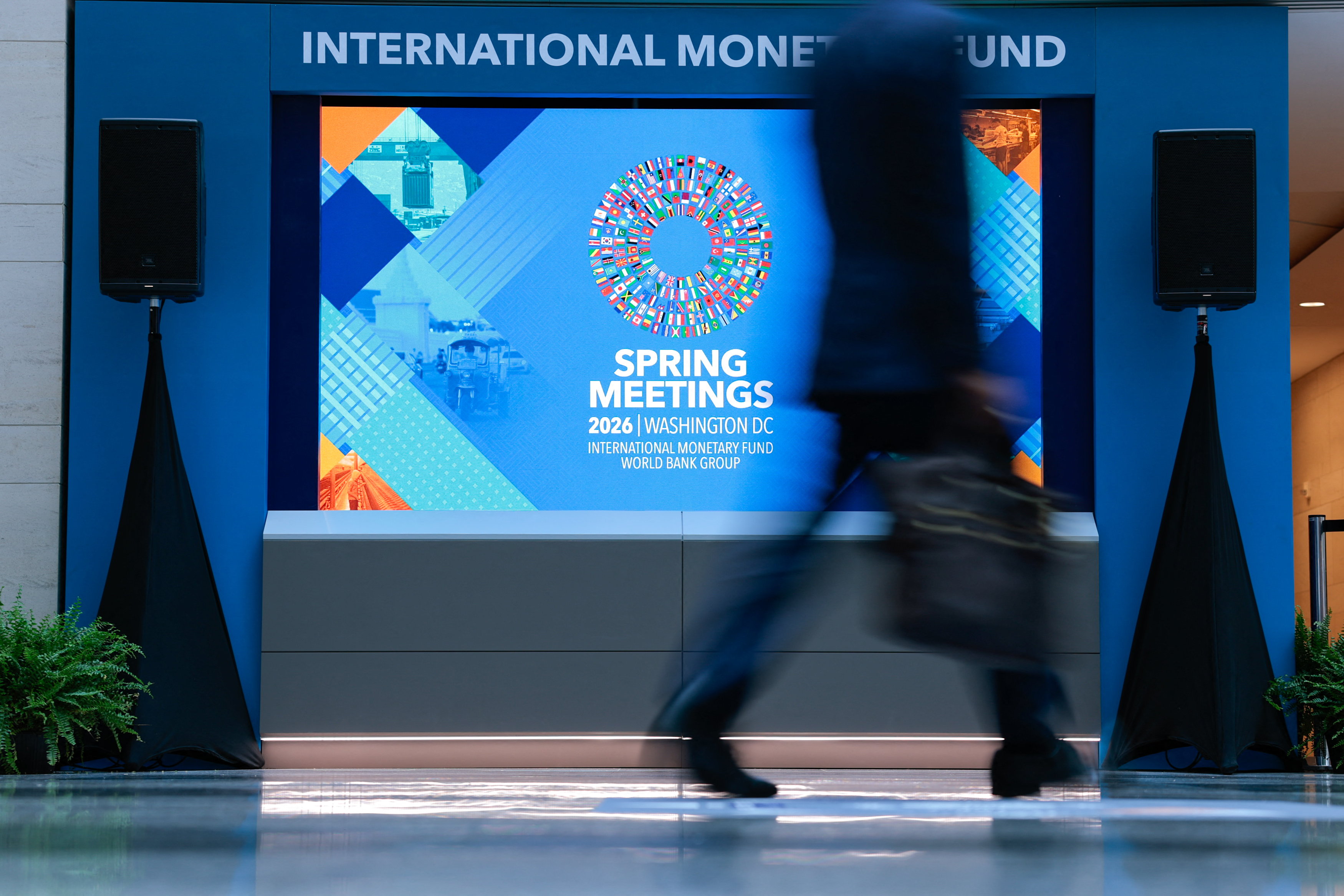 Delegates walk through the atrium at the IMF and World Bank Spring Meetings in Washington DC, April 14, 2026