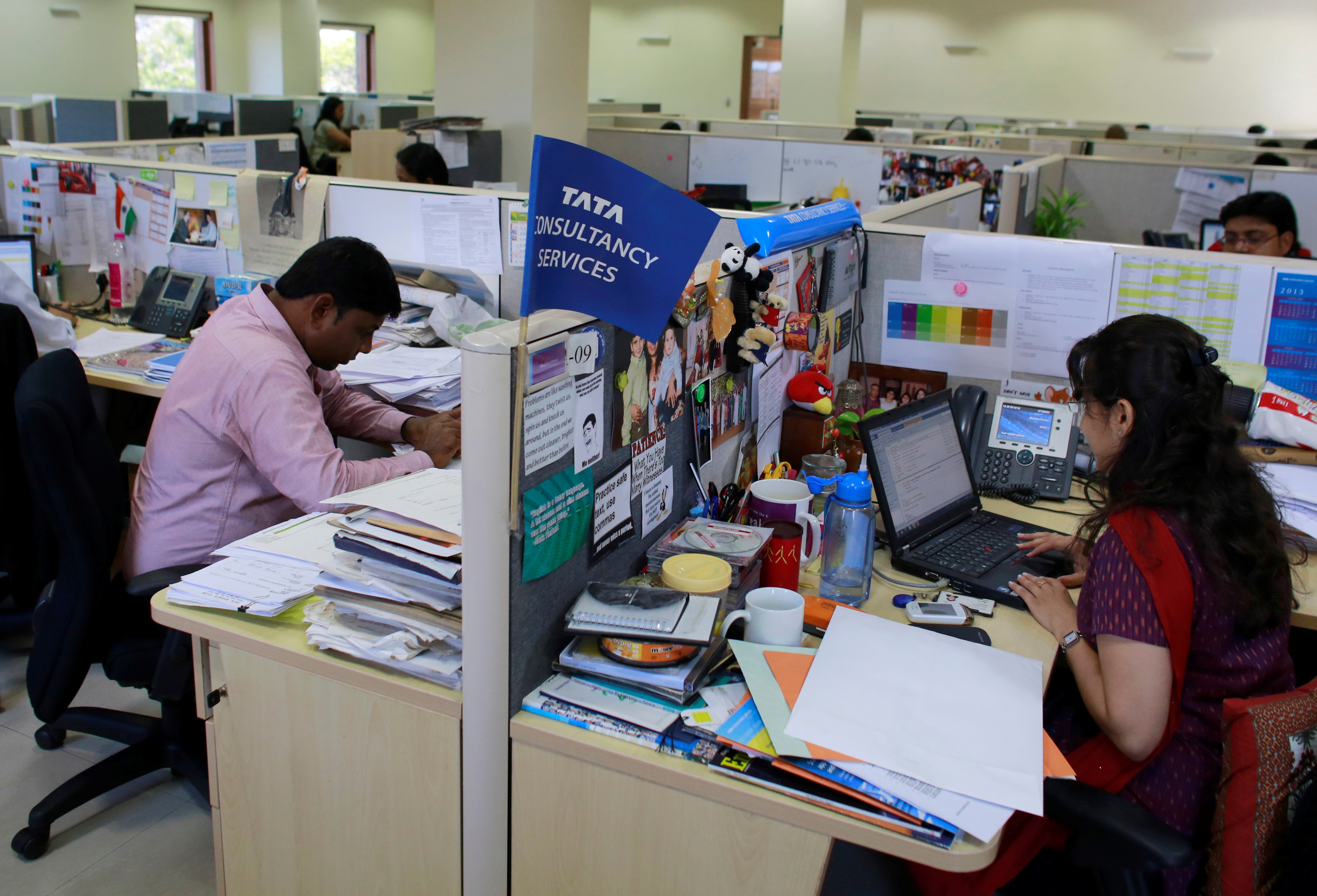 Employees work at the Tata Consultancy Services headquarters in Mumbai, India
