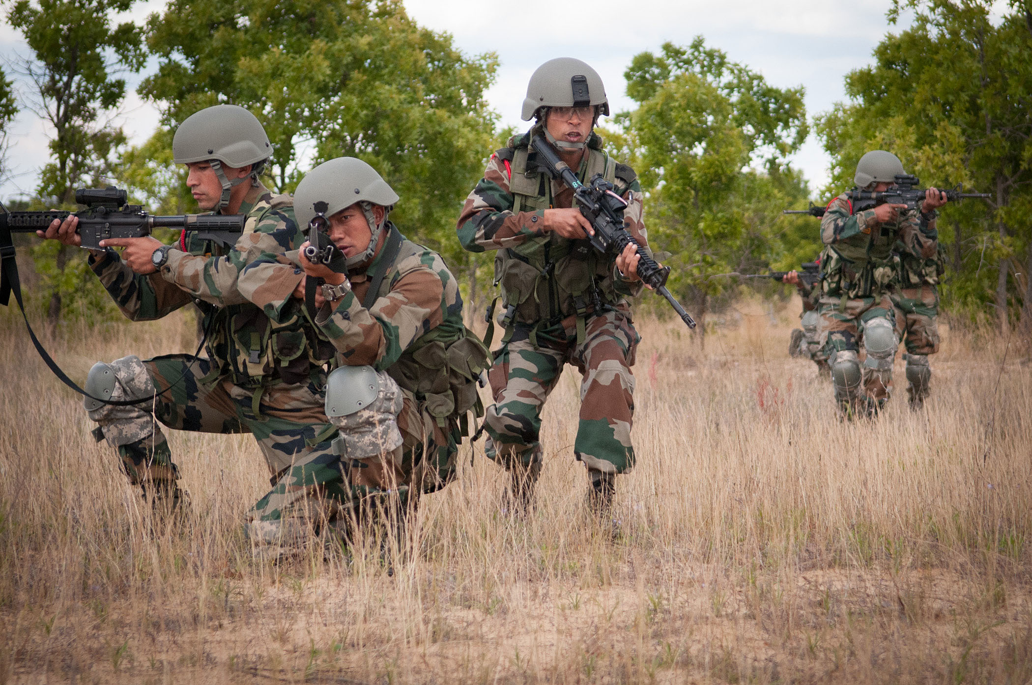Indian Army soldiers move into position during a platoon-level ambush demonstration in the Yudh Abhyas joint exercise