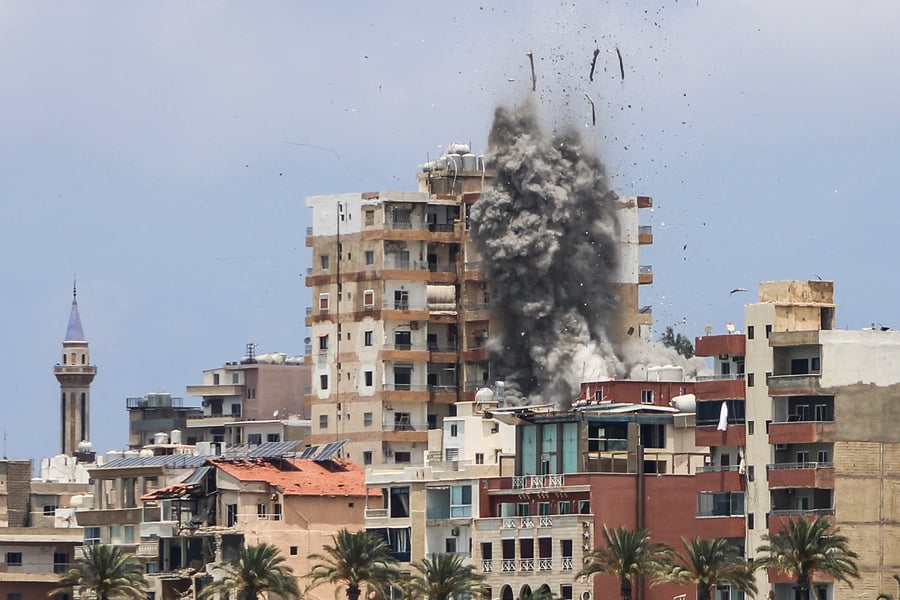 Smoke and debris rise over Tyre, southern Lebanon, after an Israeli air strike on June 9, 2026