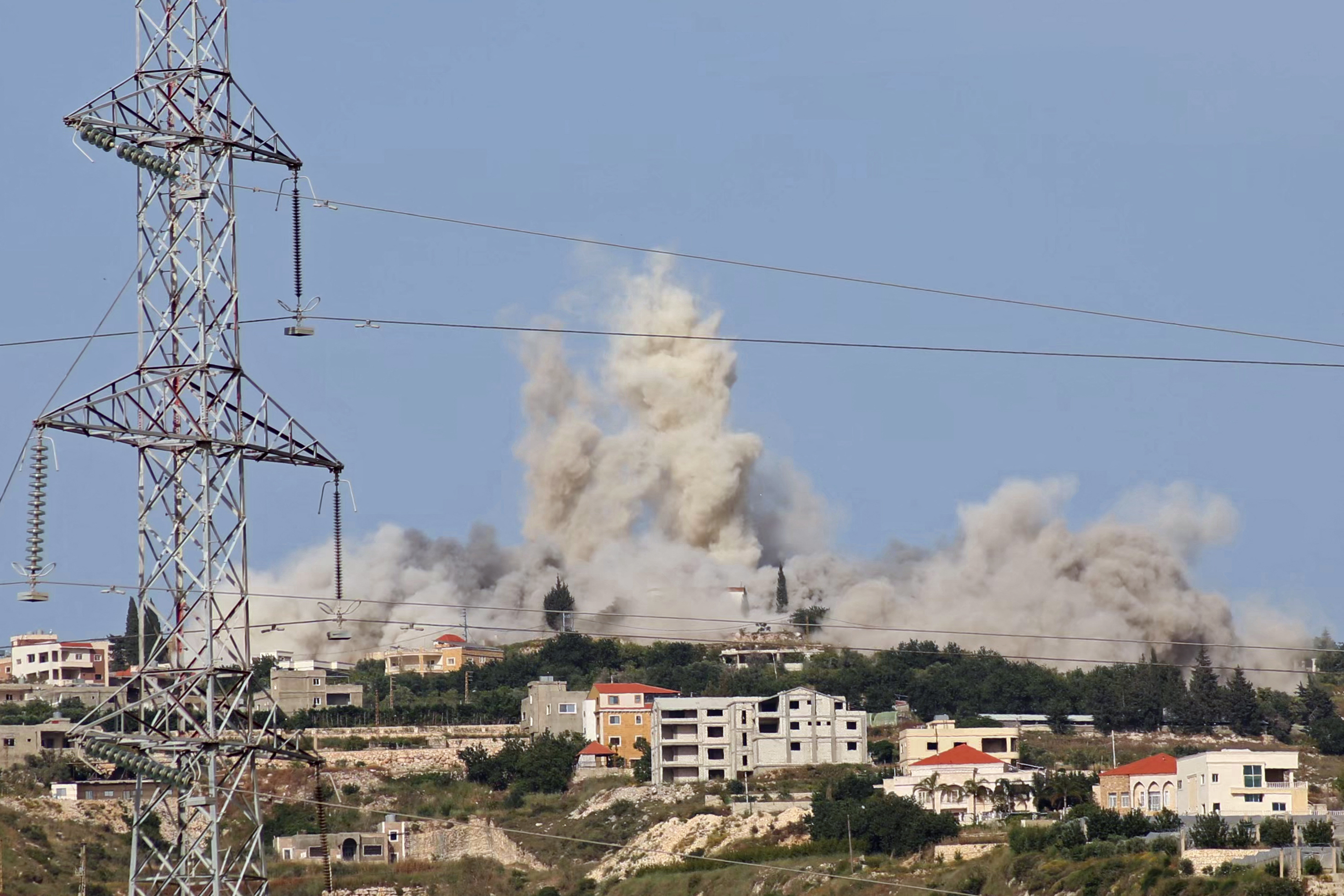 Smoke rises from an Israeli air attack on a southern Lebanese village as Hezbollah continues operations against Israeli forces