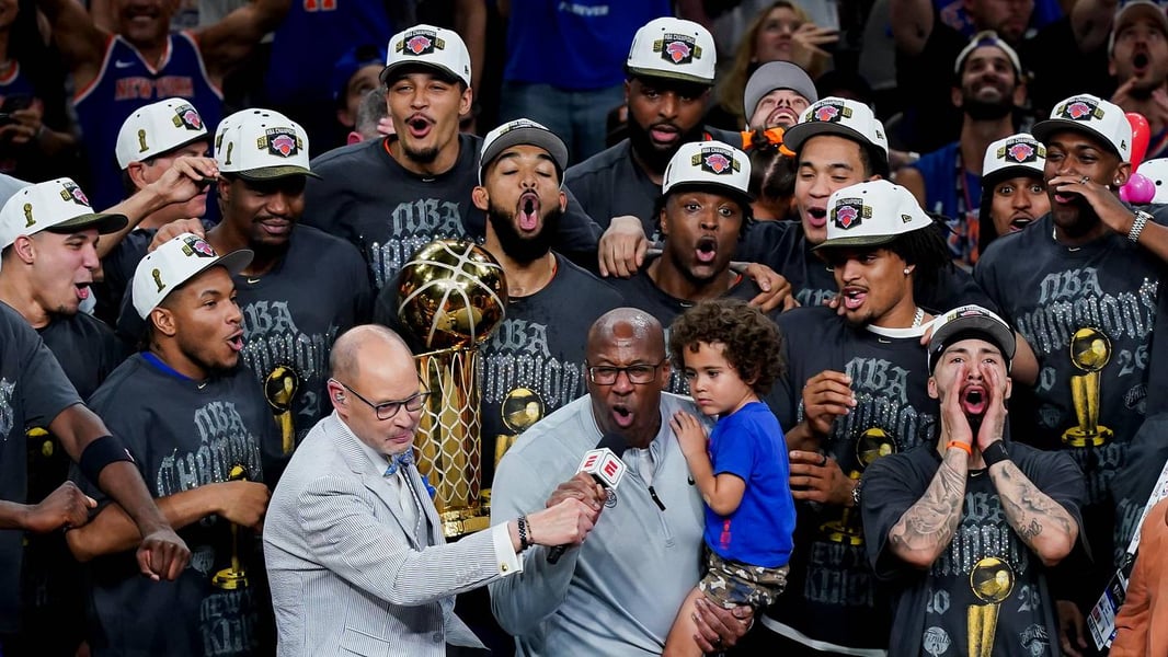 New York Knicks players celebrate their 2026 NBA championship, heading toward the Canyon of Heroes ticker-tape parade