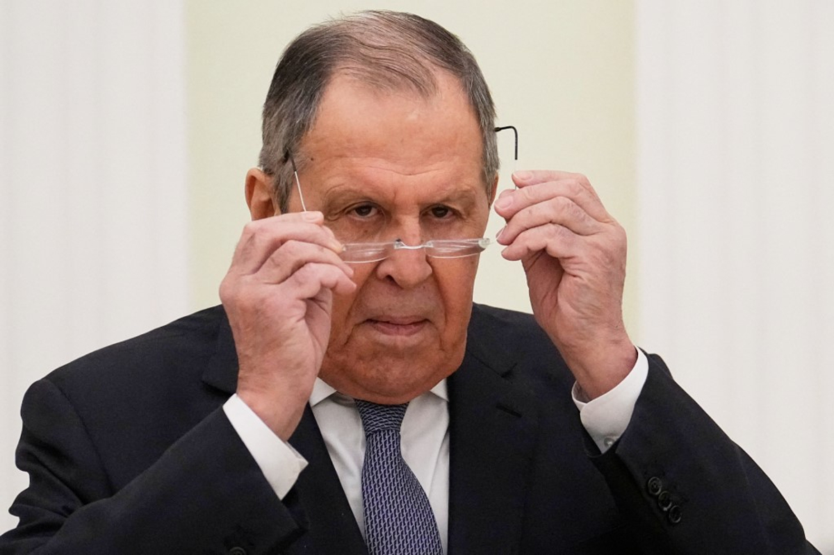 Russian Foreign Minister Sergey Lavrov adjusts his glasses at the Kremlin during a meeting, April 2, 2026